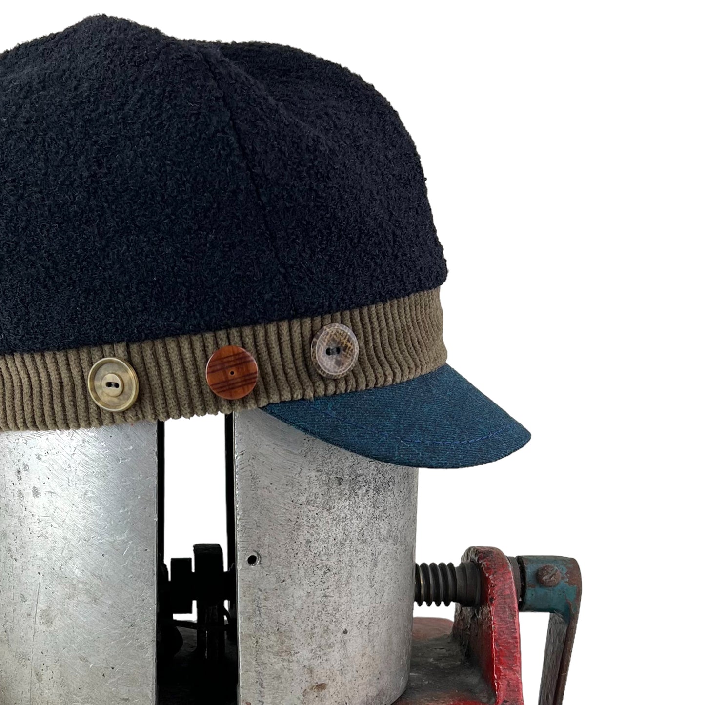 The Rowan Wool Bouclé Cap Medium Olive Band Blue Peak