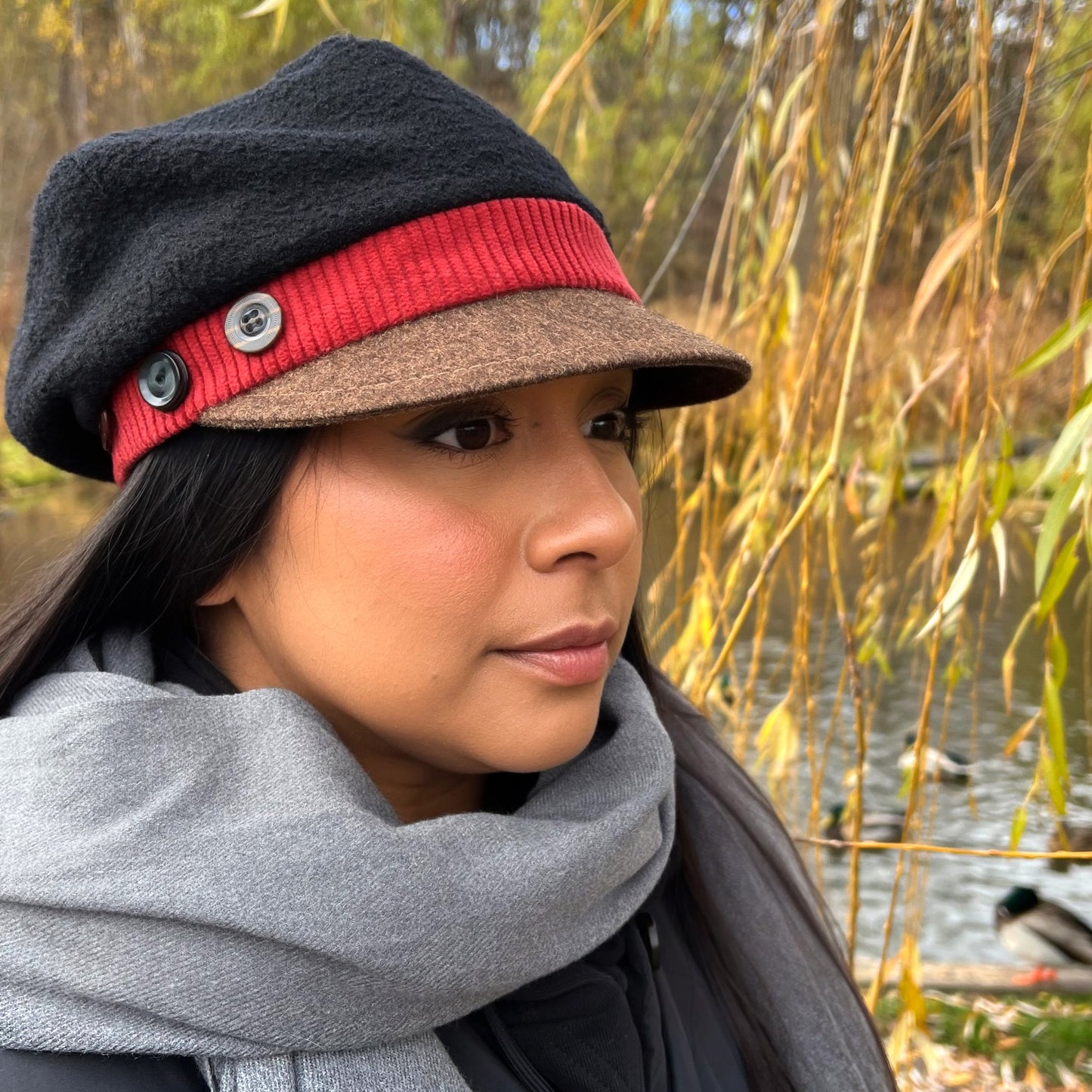 The Rowan Wool Bouclé Cap Medium Papaya Red Band Brown Peak