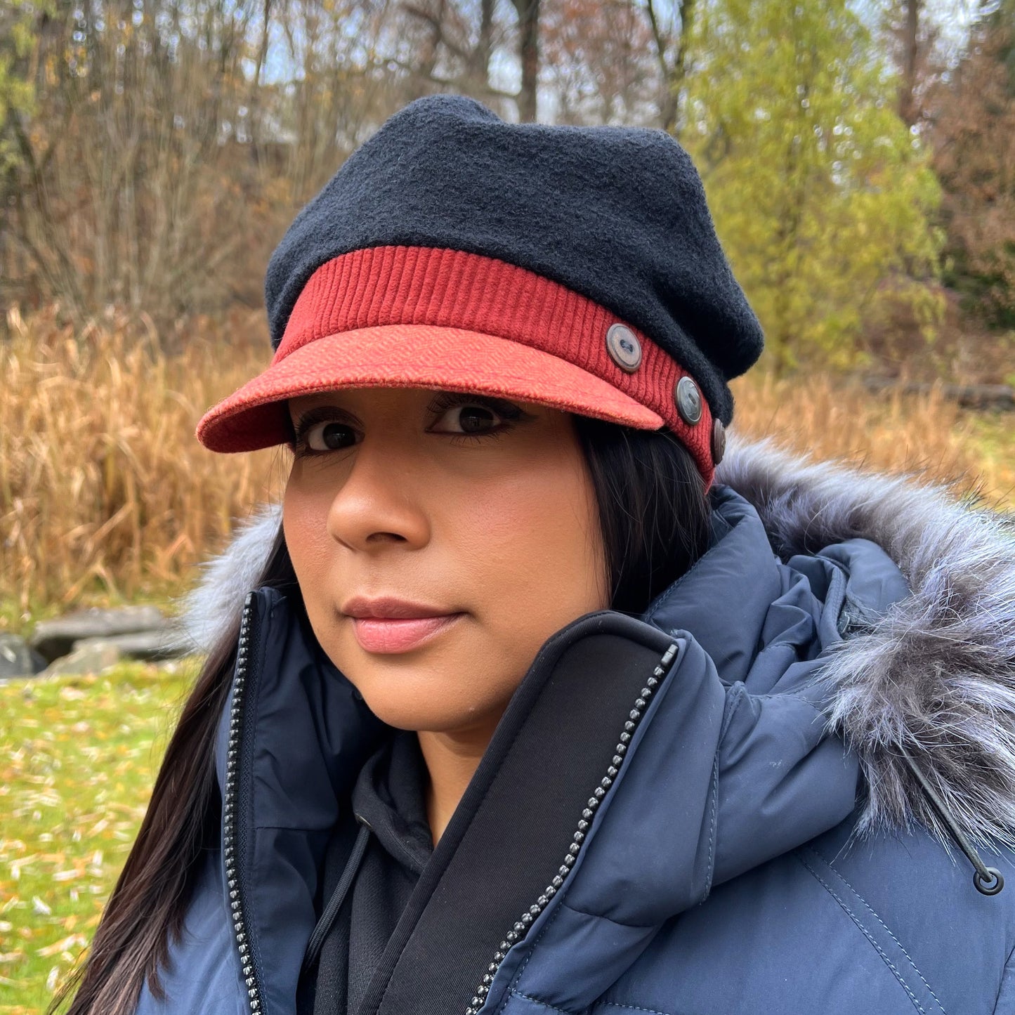 The Rowan Wool Bouclé Cap Medium Papaya Red Band Orange Peak